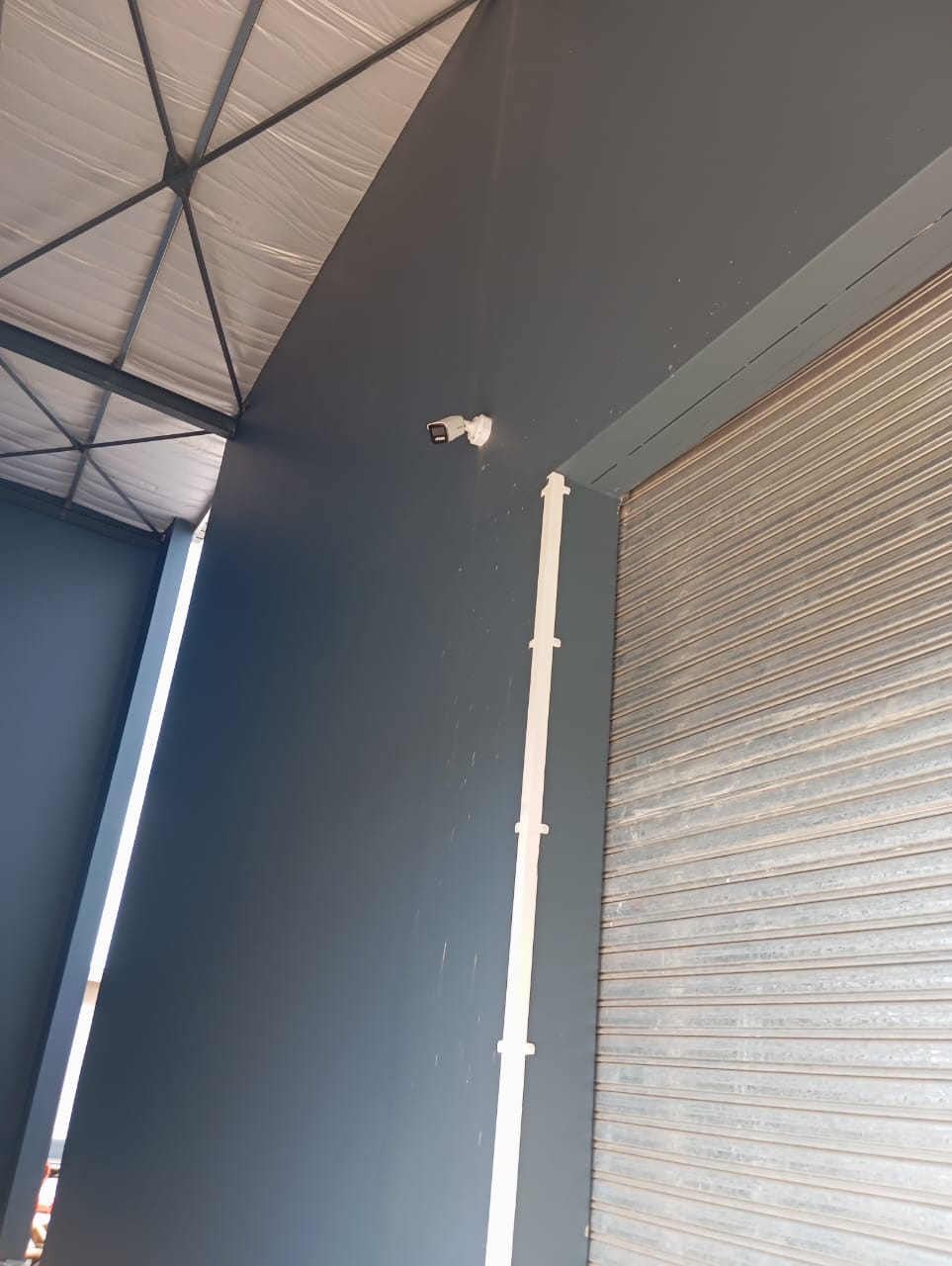 CCTV camera and neat conduit installed inside a warehouse