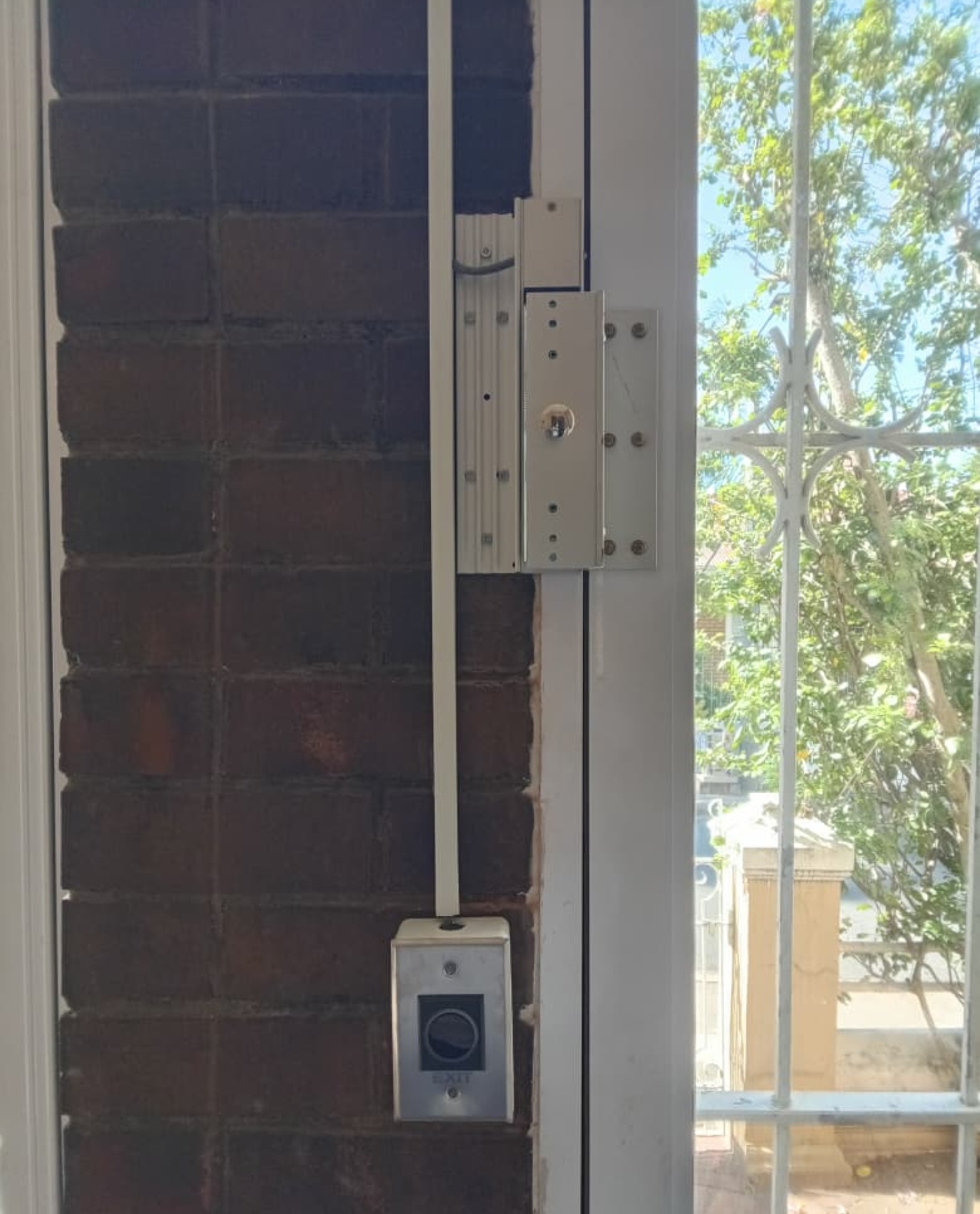 Strike lock and exit-button arrangement on the Bell Grove entrance
