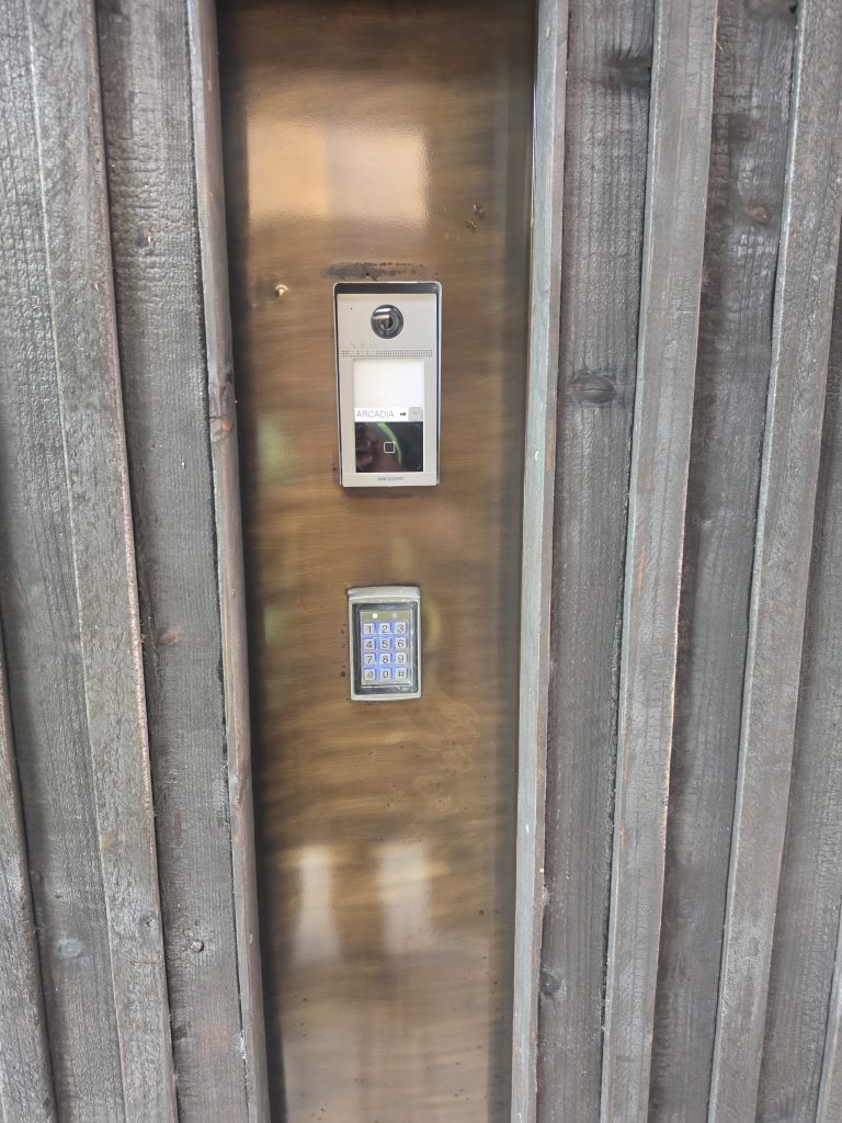 Hikvision intercom and keypad installed beside a wooden entrance in Umdloti