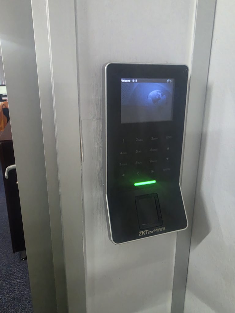 Zapture fingerprint and keypad access reader fitted beside an office door