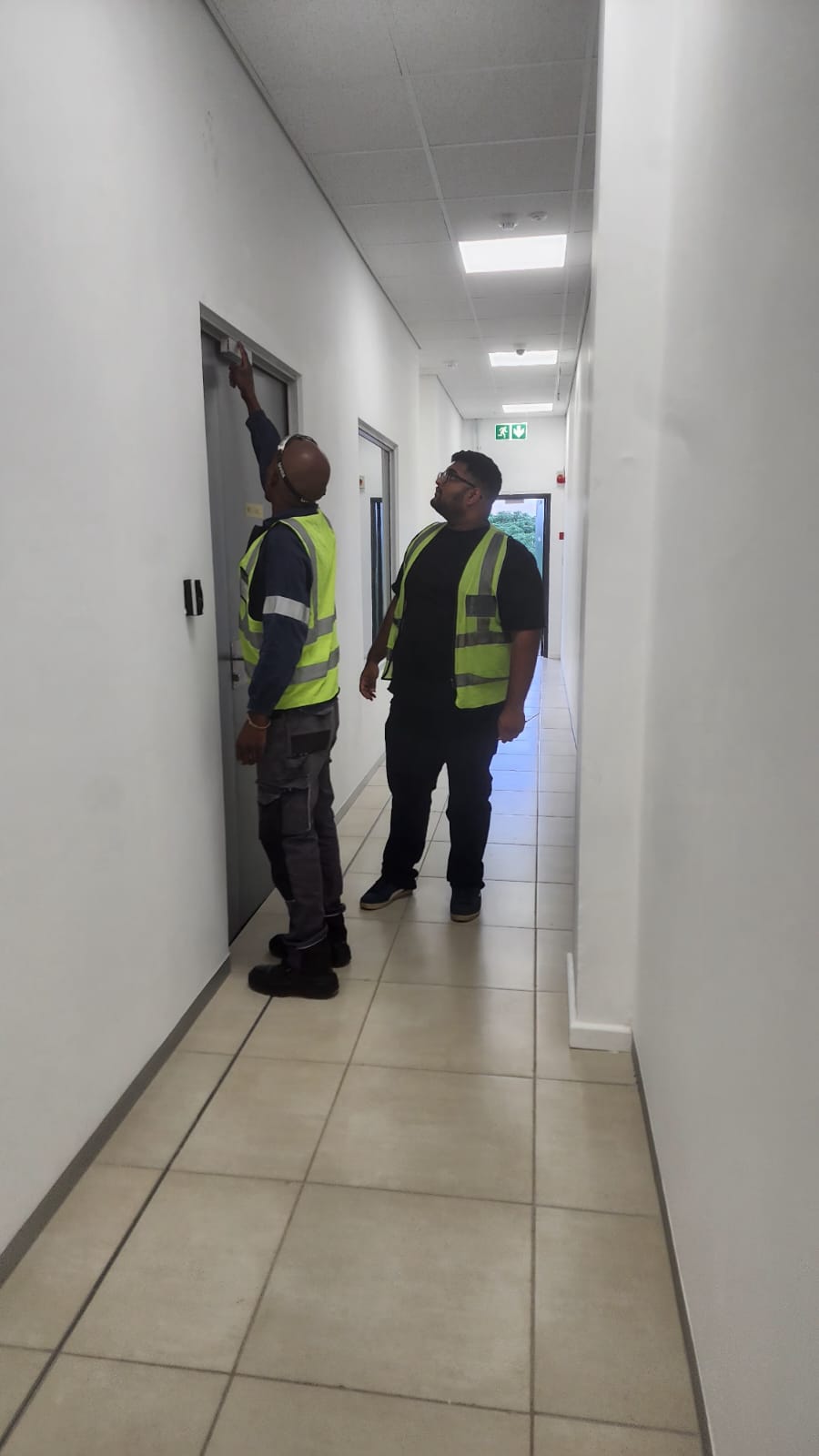 Zapture team inspecting the office entrance during the Amanzimtoti access control installation