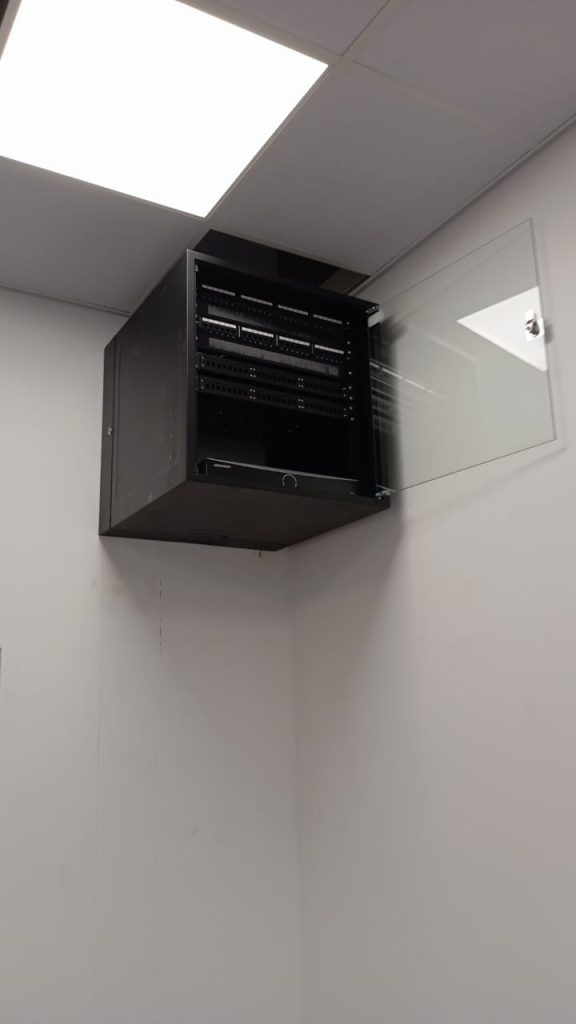 Wall-mounted network cabinet installation