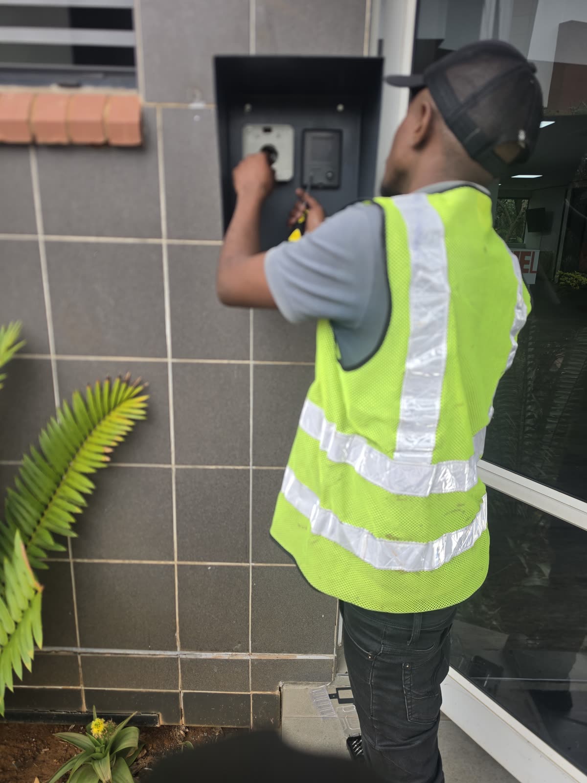Technician working on an access-control installation